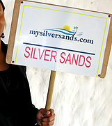 rep holding sign for airport pick-up