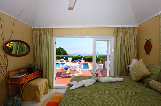 blue vista villa,silver sands jamaica, master bedroom with pool and sea view