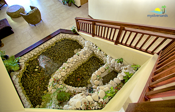 fish pond beside the stairs