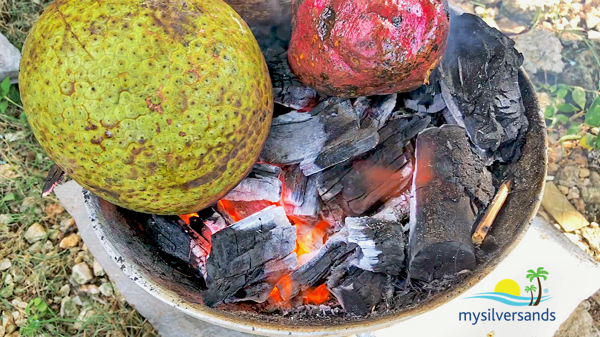 breadfruit  and sweet potato on the coal fire