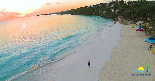 lynn running on the beach at sunrise