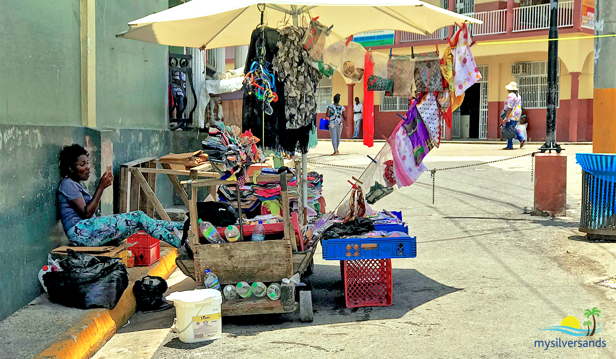 vendor on side street with handcart