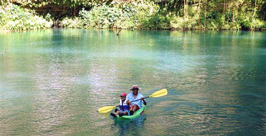 Tej and I kayaking back to the river bank