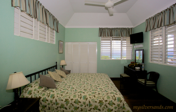bedroom two of honeycomb villa with king size bed