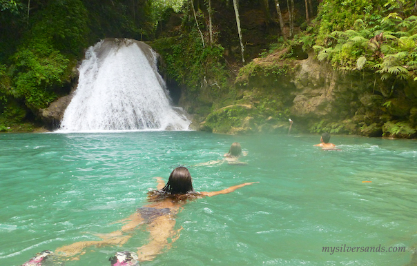 swimming up to the waterfall at blue hole in ocho rios jamaica