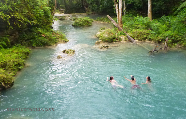 swimming in large pool at blue hole waterfalls in ocho rios jamaica