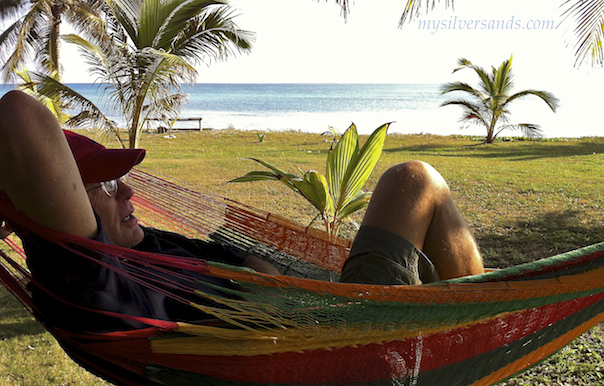 geoff gibson relaxes in hammock on the beachfront at endless summer in silver sands villas jamaica