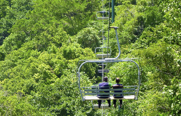 riding the chair lift to the mystic mountain attraction