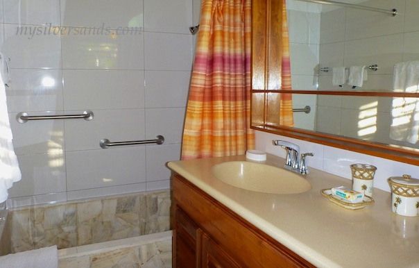 bathroom en suite of master bedroom at roots cottage in silver sands villas