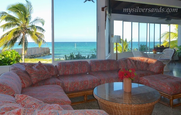living room with sea view at roots cottage in silversands jamaica