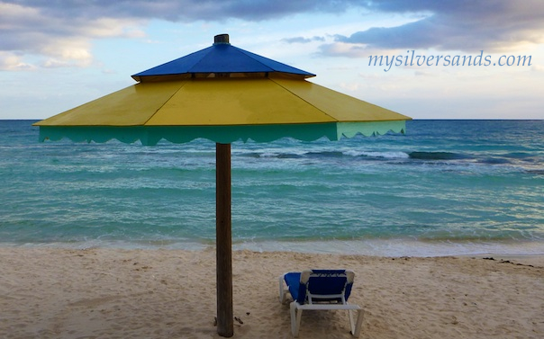 yellow beach cabana and lounge chair at silver sands villas jamaica