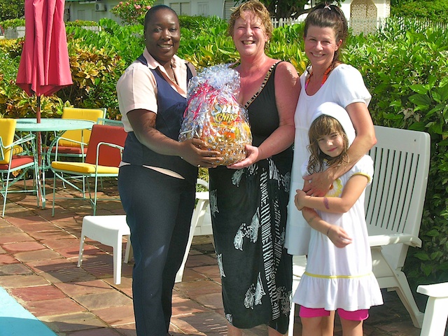 desrine presents welcome gift to sandra at valhalla silver sands jamaica