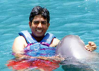 prem hugs the dolphin