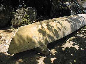 Dug out canoe being made on the beach