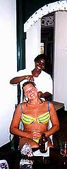 kelli having her hair braided by carol