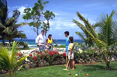 Playing croquet on the front lawn of orchid house