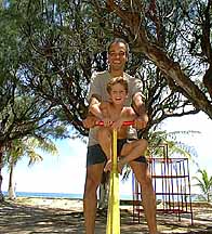 riding the see-saw at the play area at silver sand