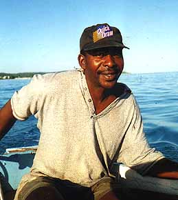 errol in his boat taking snorkelers out to the reef