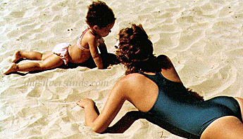 woman and child on the sand, at beach at jamaica accommodations