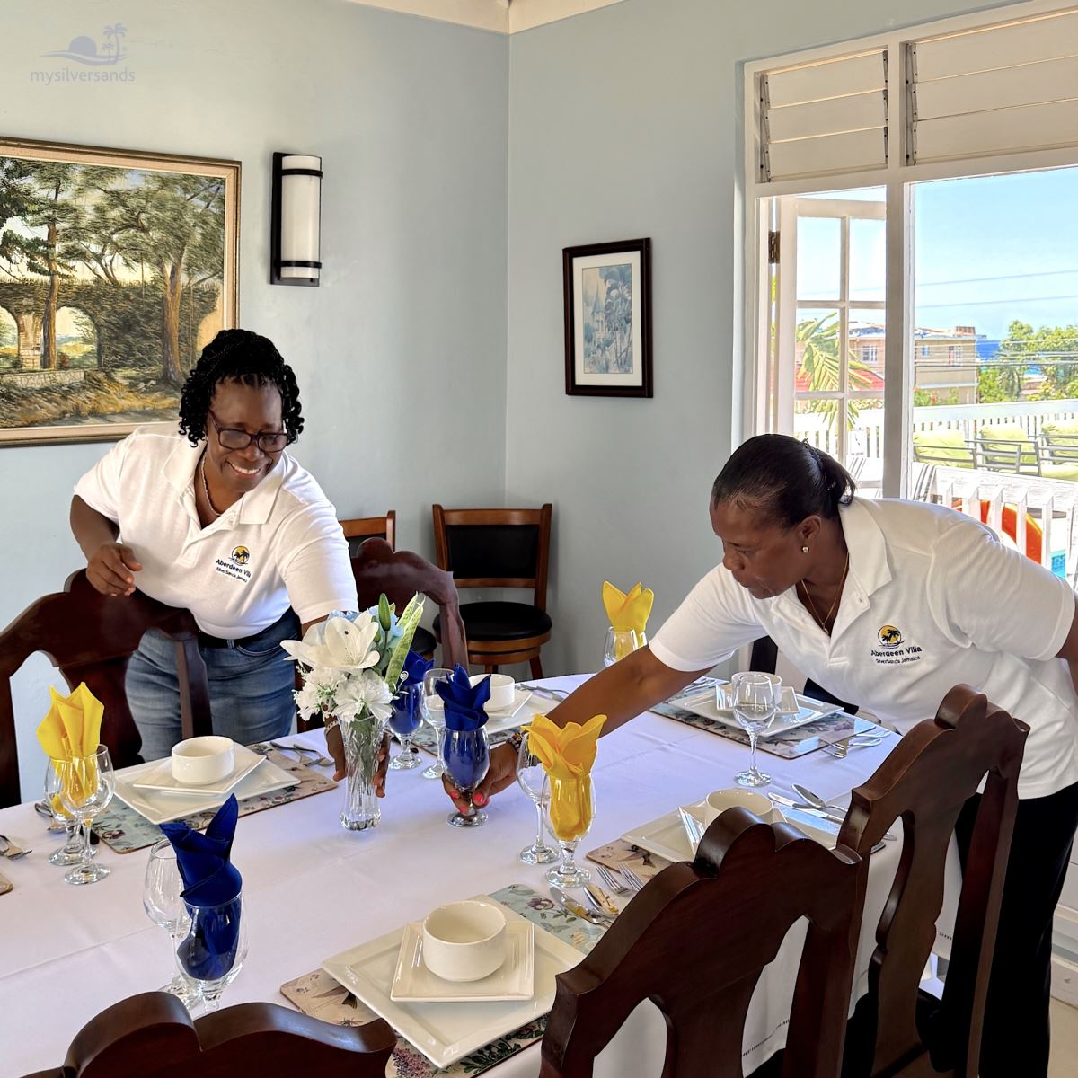 esther and gwen setting the table
