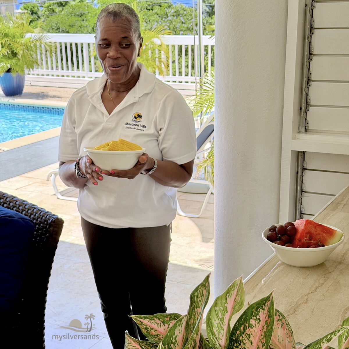 gwen with serving bowl on the verandah
