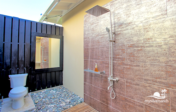 poolside bathroom with toilet and shower