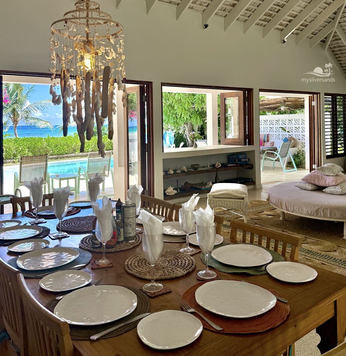 dining table and living room with sea view