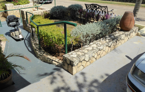 Concrete ramp from driveway to entrance to endless summer