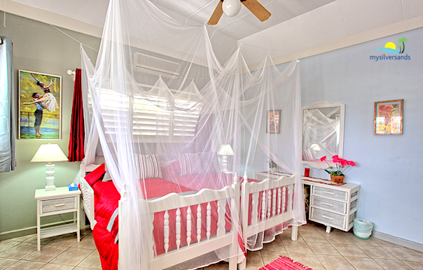 bedroom two with mosquito nets