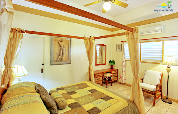 bedroom 3 is furnished with a canopy bed