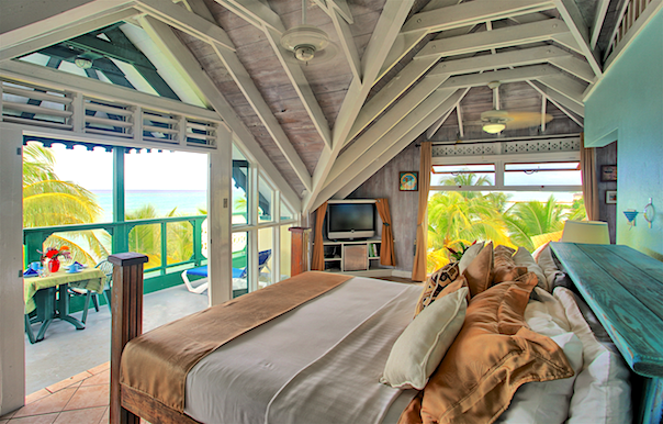 Bedroom 5 opens out through a wide doorway to a private balcony with amazing sea views.