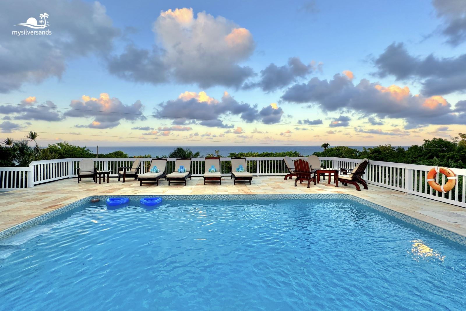 pool at honeycomb villa at sunset