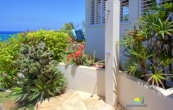 outdoor shower at entrance to lamar villa