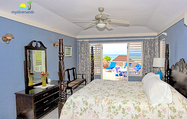 master bedroom with view of pool