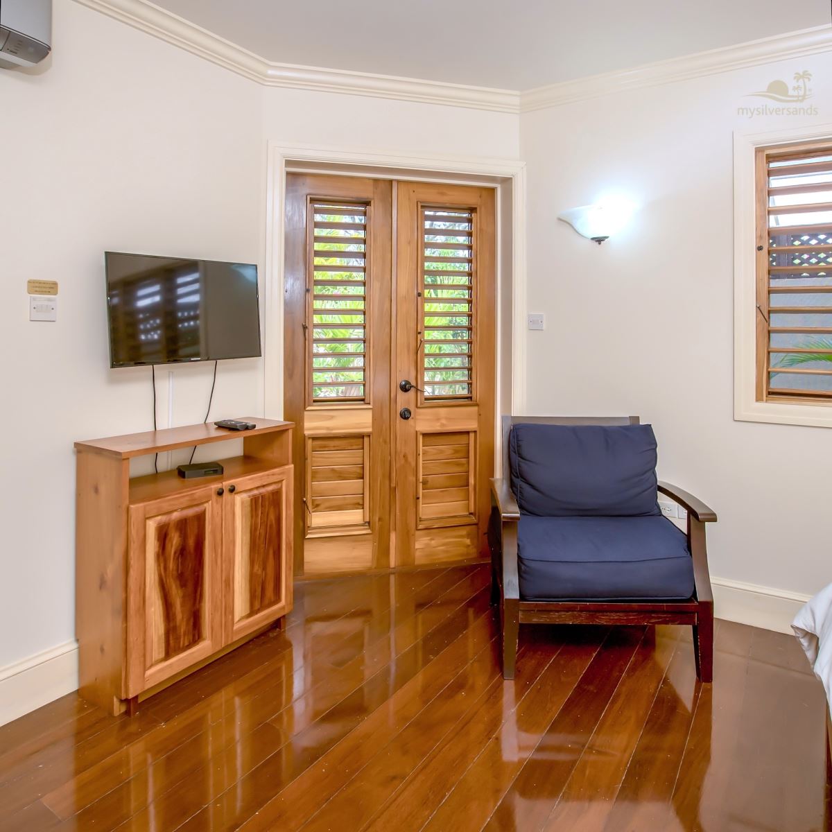 bedroom 5 chair and doors to garden