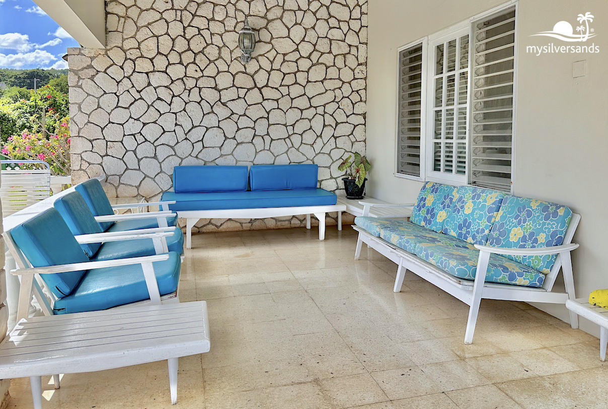 shady verandah withsofas to lounge on 
