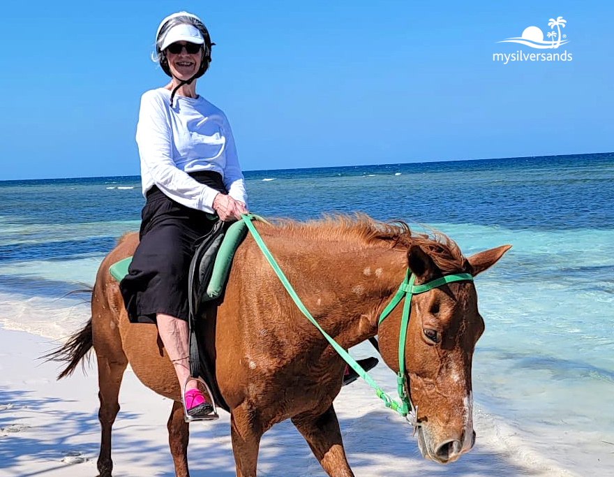 woman on horse on the beach