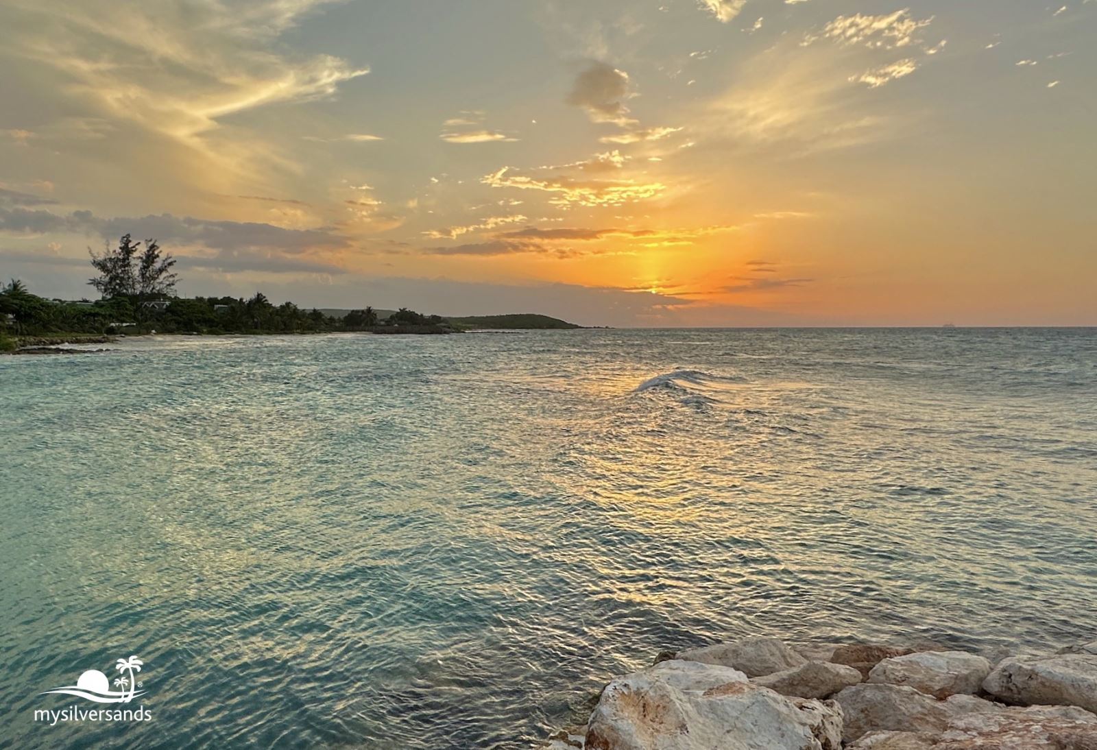 sunset over the west beach at silver sands jamaica