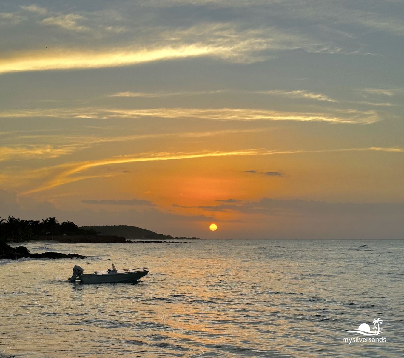 boat in the sea at sunset