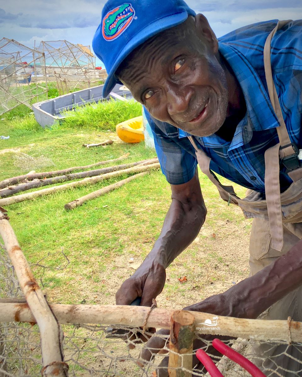 charles meggie with hammer and fishpot