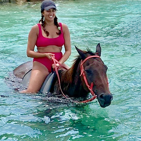 on horseback in the water