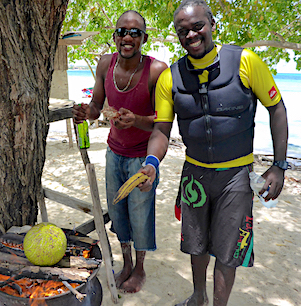 bryan and ryan rooting a breadfruit on the beach