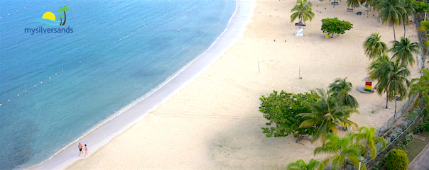 couple walking on echo rios beach