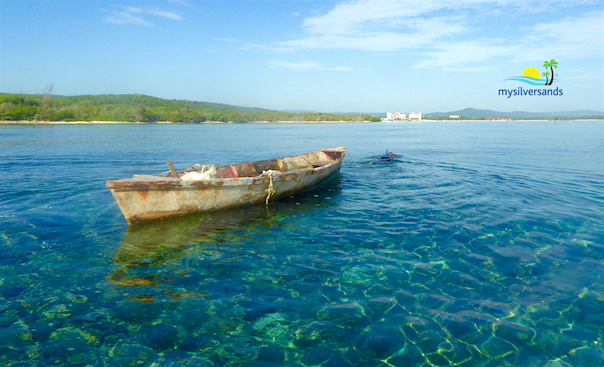 canoe and hotels in the distance