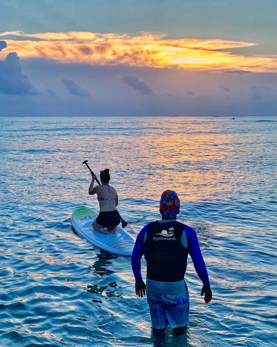 paddling away from the beach