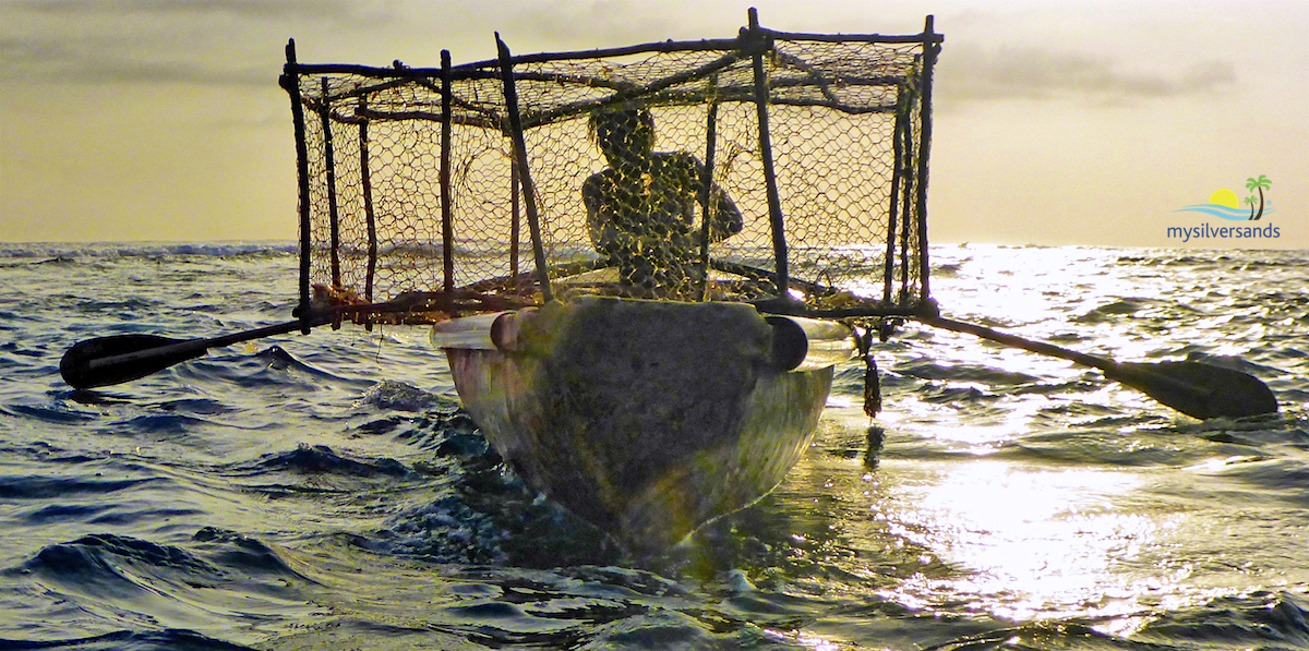 zion paddling back to set his fish pot