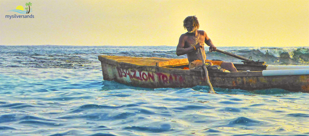 Zion rowing through a gap in the reef