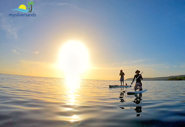 bryan and prem on standup paddle boards