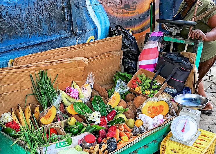 Local Jamaican produce stall with a scale—where your villa cook may shop for groceries.
