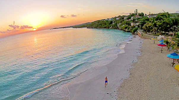 woman running on the silver sands beach